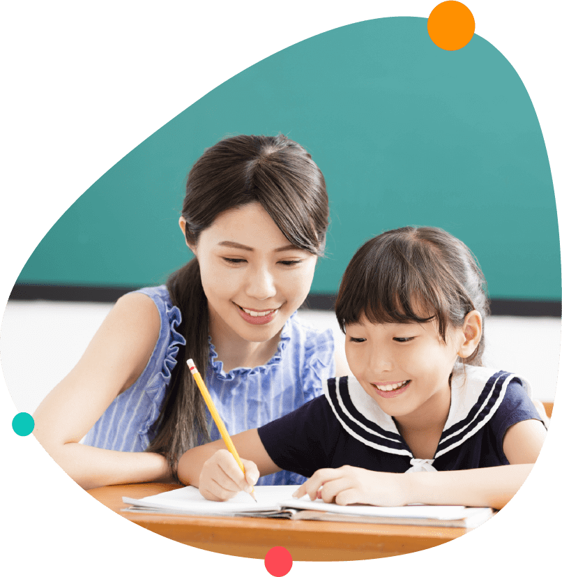 Primary School Tutor Conducting A Lesson